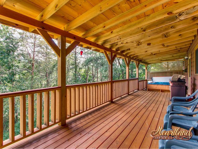 Relax on the back deck with seating and hot tub